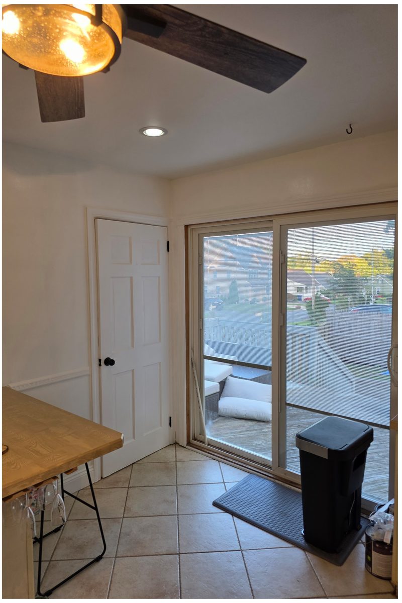 The same corner with the door, casing and walls painted white