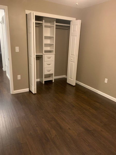 Built-in closet organiser with shelves, drawers and hanging rails